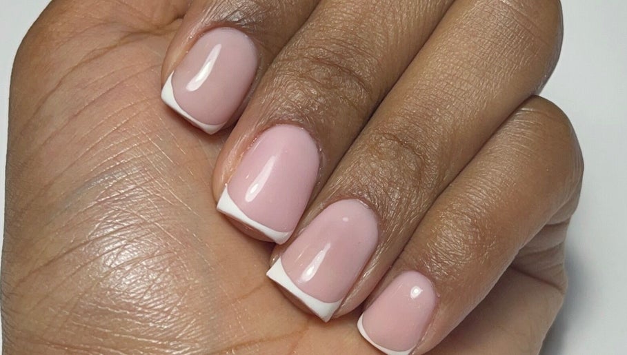 French manicure on hand at Nail Kulture, Rochdale, England, GB, showcasing exquisite nail art.