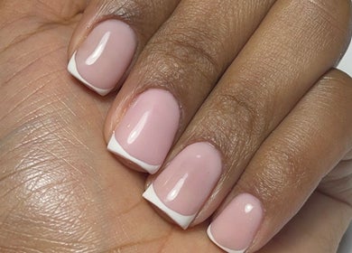 French manicure on hand at Nail Kulture, Rochdale, England, GB, showcasing exquisite nail art.