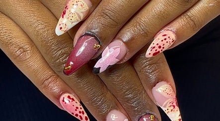 Creative nail art with red and pink designs at Nail Kulture, Rochdale, England, GB.