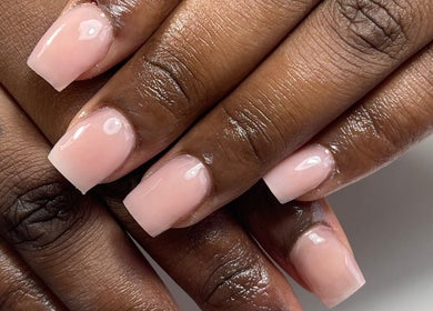 Elegant glossy nude nails freshly manicured at Nail Kulture, Rochdale, England, GB. Perfect for any occasion.