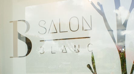 Front window of Salon Blanc, Cape Town, Western Cape, ZA showcasing stylish branding.