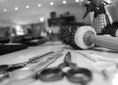 Close-up of styling tools at Salon Blanc, Cape Town, Western Cape, ZA, showcasing a chic hairdressing setup.
