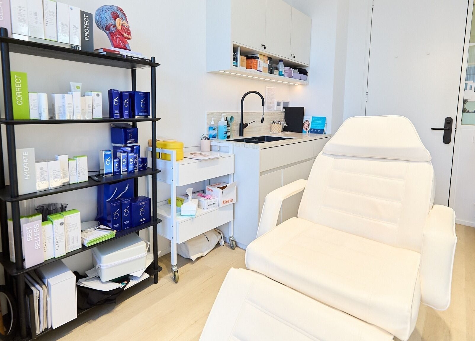 Cosmetics By Nurse Blake treatment room at Bondi Junction, New South Wales, AU with skincare products and recliner.