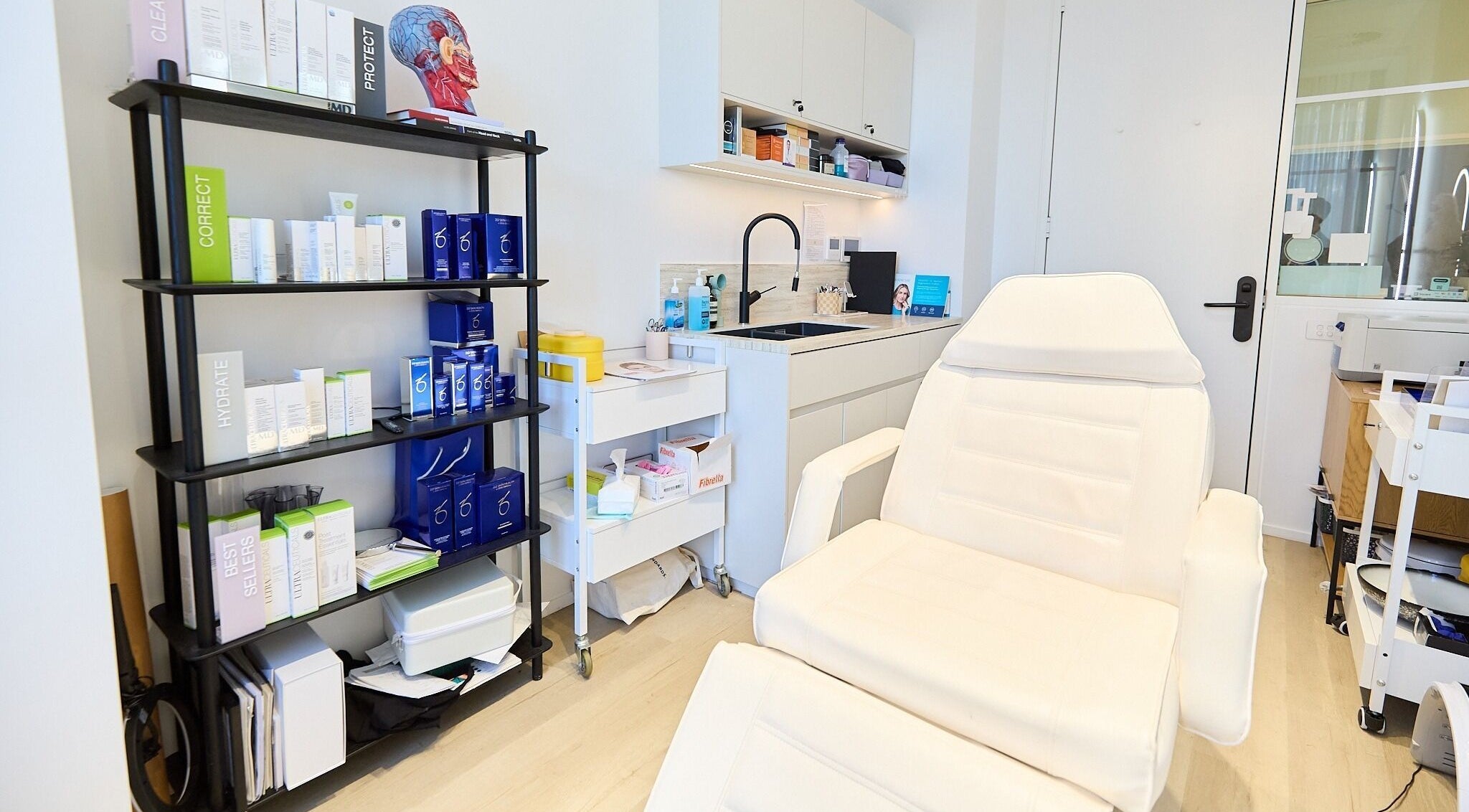Cosmetics By Nurse Blake treatment room at Bondi Junction, New South Wales, AU with skincare products and recliner.