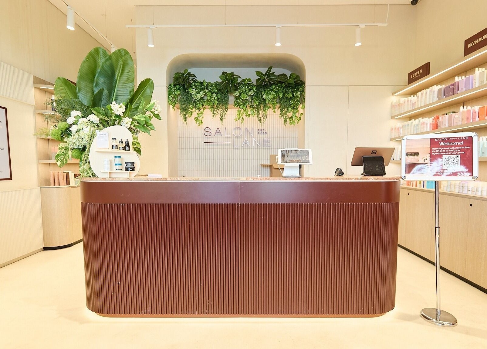 Reception area of Cosmetics By Nurse Blake, Bondi Junction, NSW, AU with lush plants and product displays.