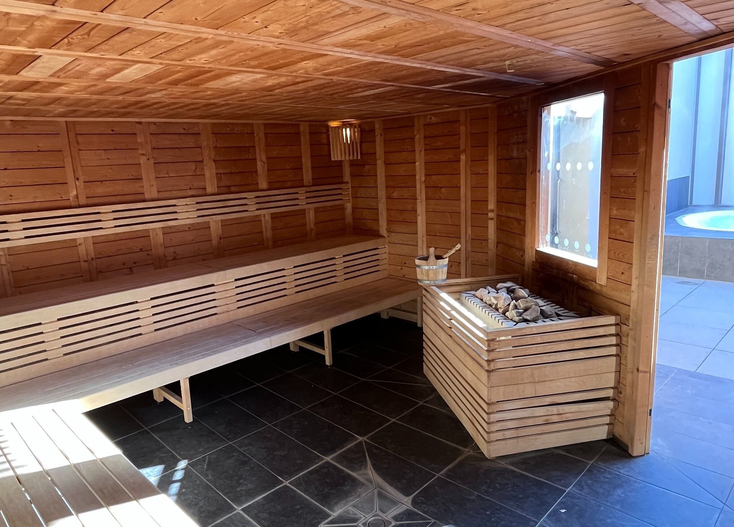 Warm wooden sauna at Spa Arzana in Rueil-malmaison, Île-de-france, FR for a relaxing experience.