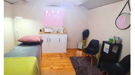 Serene wax room at DMA Beauty, Cape Town, Western Cape, ZA, featuring modern decor and comfortable seating.