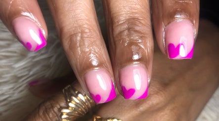 Vibrant pink heart nails designed at Studio Lady Garnet, Port of Spain, Port of Spain Corporation, TT.