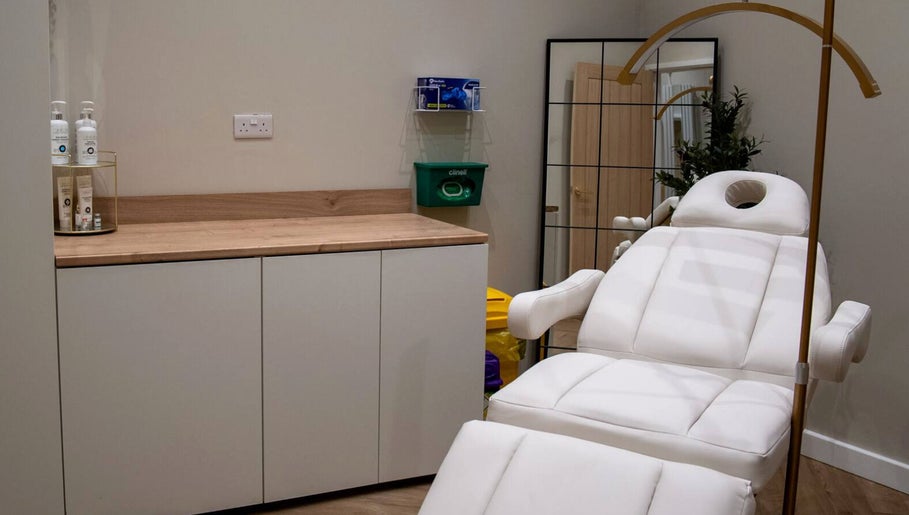 Relaxation room at Enhance Taunton with white spa bed, serene ambiance in Taunton, England, GB.