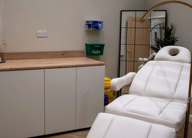 Relaxation room at Enhance Taunton with white spa bed, serene ambiance in Taunton, England, GB.