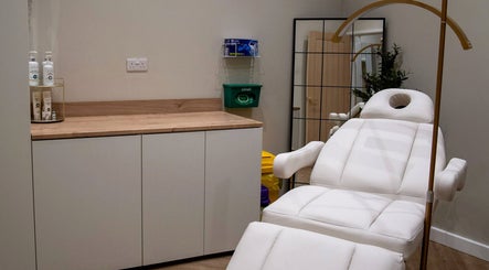 Relaxation room at Enhance Taunton with white spa bed, serene ambiance in Taunton, England, GB.