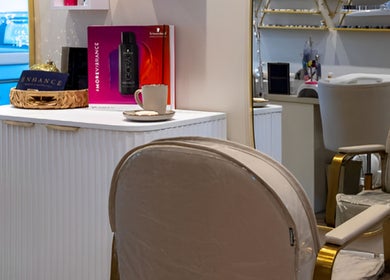 Elegant salon interior at Enhance Taunton in Taunton, England, GB showcasing chic decor and beauty products.
