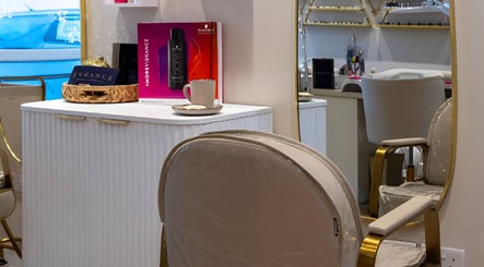 Elegant salon interior at Enhance Taunton in Taunton, England, GB showcasing chic decor and beauty products.