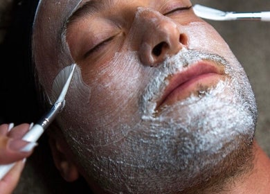 Man receiving a soothing facial treatment at Enhance Taunton, Taunton, England, GB.