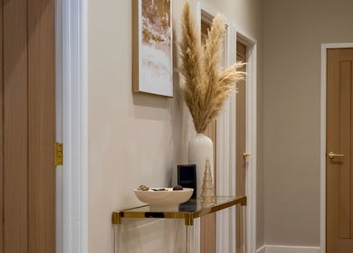 Elegant hallway decor at Enhance Taunton, Taunton, England, GB featuring pampas grass and wall art.
