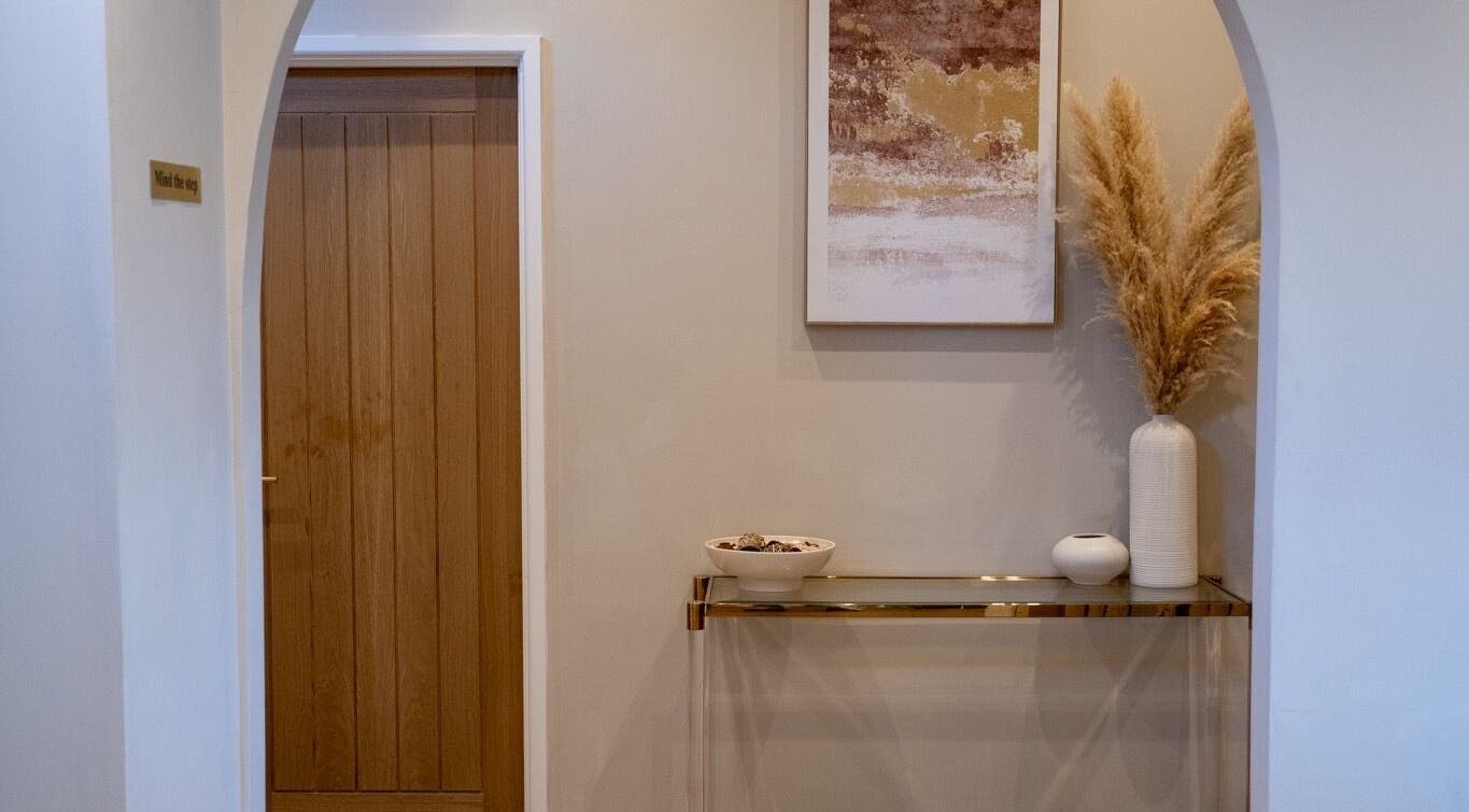 Elegant hallway at Enhance Taunton, Taunton, England, GB showcasing refined decor and warm tones.