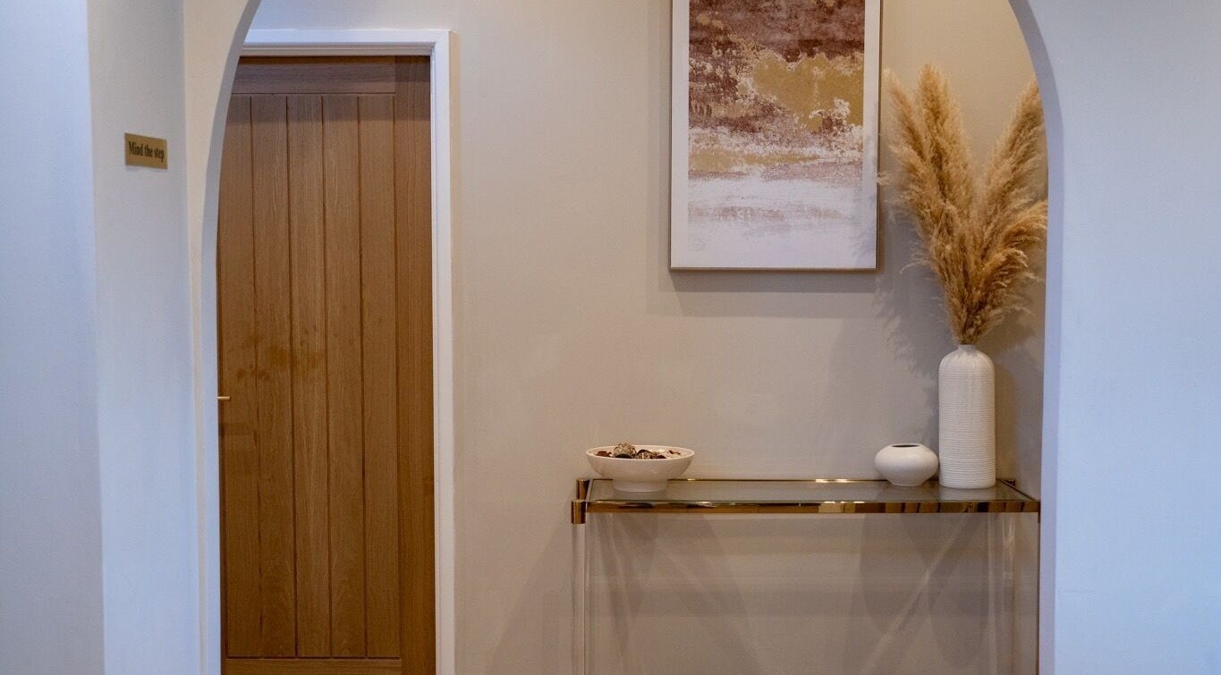 Elegant hallway at Enhance Taunton, Taunton, England, GB showcasing refined decor and warm tones.