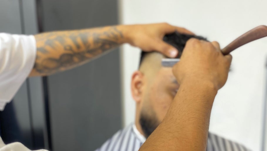Barber crafting a detailed fade at Meister Fades, Cape Town, Western Cape, ZA.