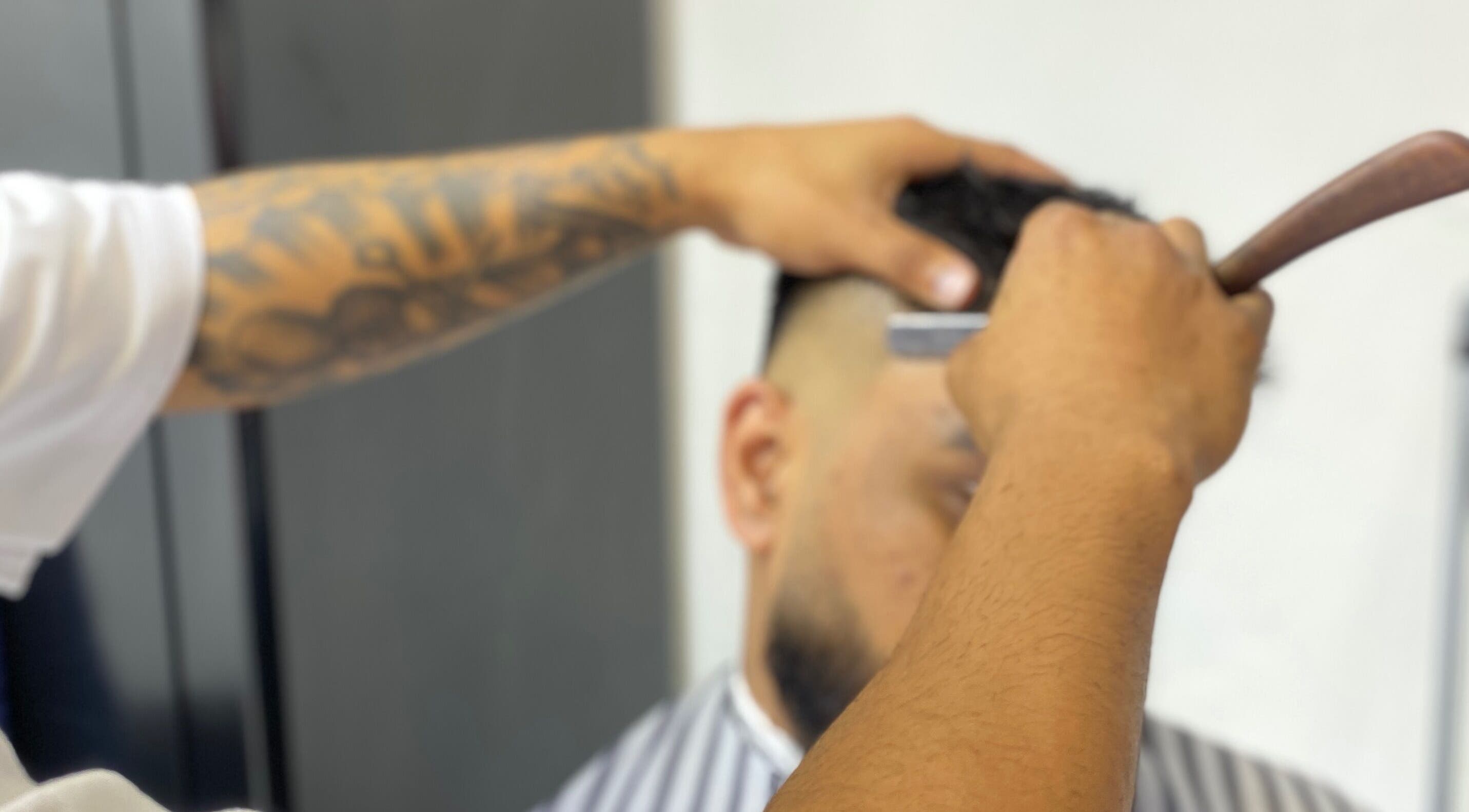 Barber crafting a detailed fade at Meister Fades, Cape Town, Western Cape, ZA.