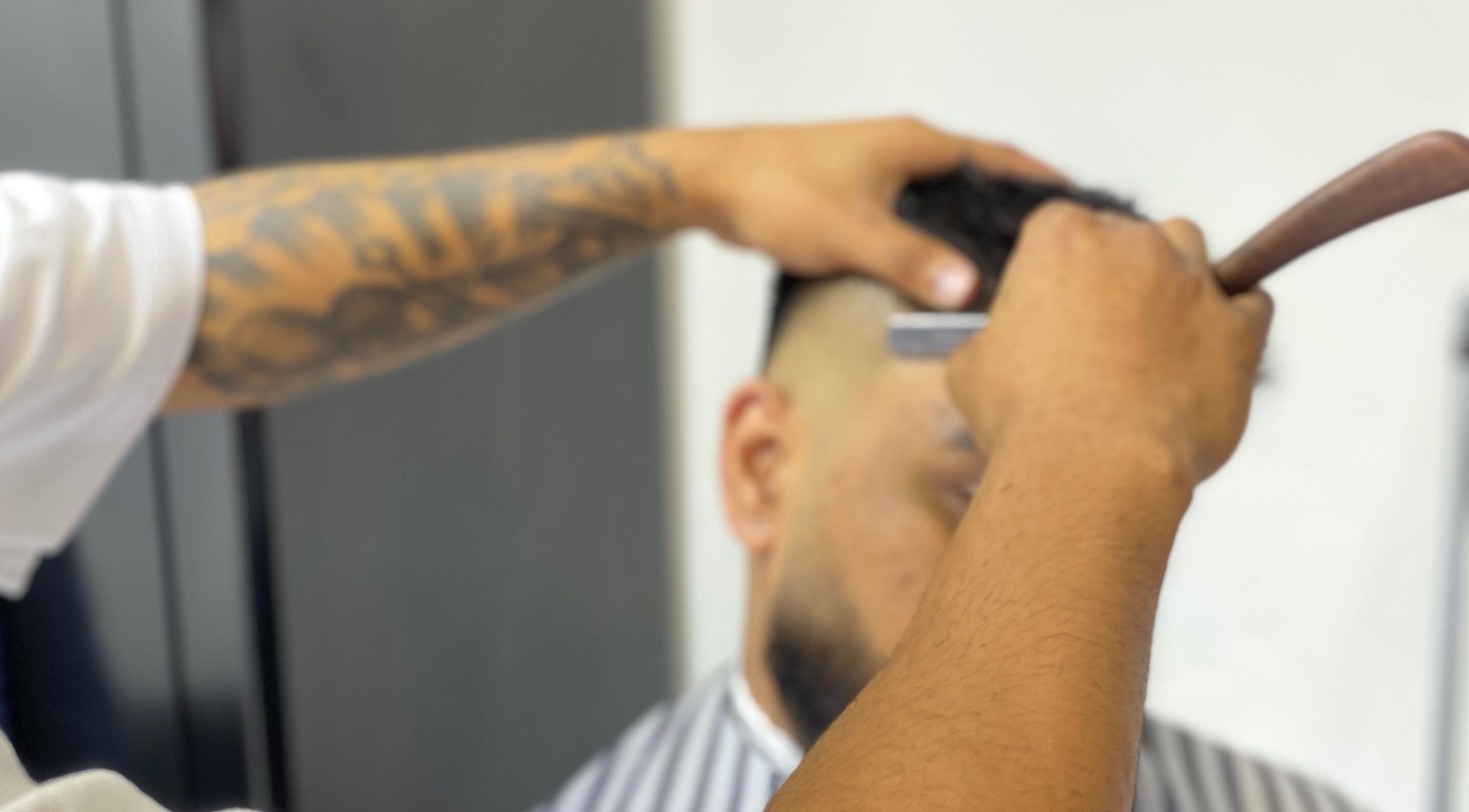 Barber crafting a detailed fade at Meister Fades, Cape Town, Western Cape, ZA.