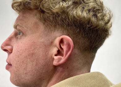 Fresh curly haircut at Meister Fades in Cape Town, Western Cape, ZA, highlighting expert barber skills.