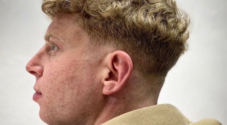 Fresh curly haircut at Meister Fades in Cape Town, Western Cape, ZA, highlighting expert barber skills.