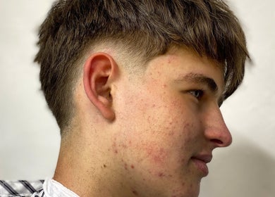 Profile view of a stylish taper haircut at Meister Fades, Cape Town, Western Cape, ZA.