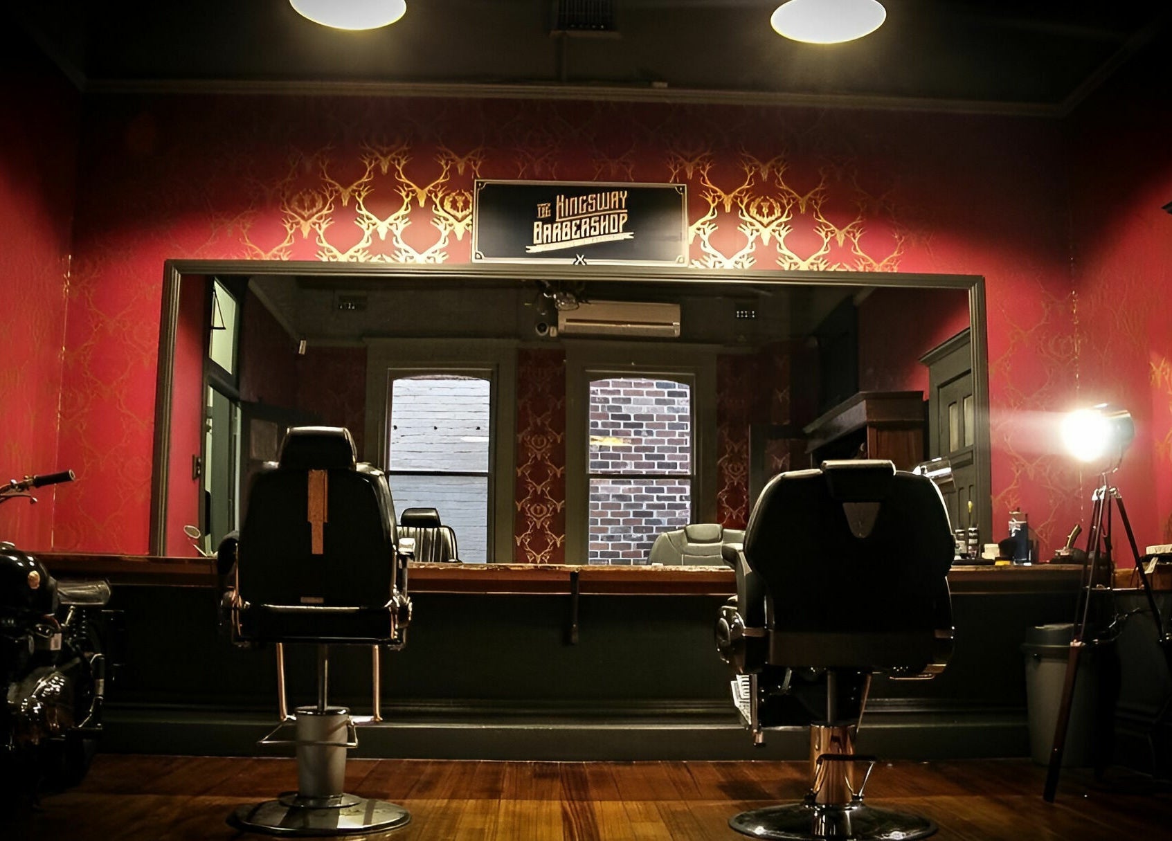 Interior of The Kingsway Barbershop in Launceston, Tasmania, AU features vintage decor and barber chairs.