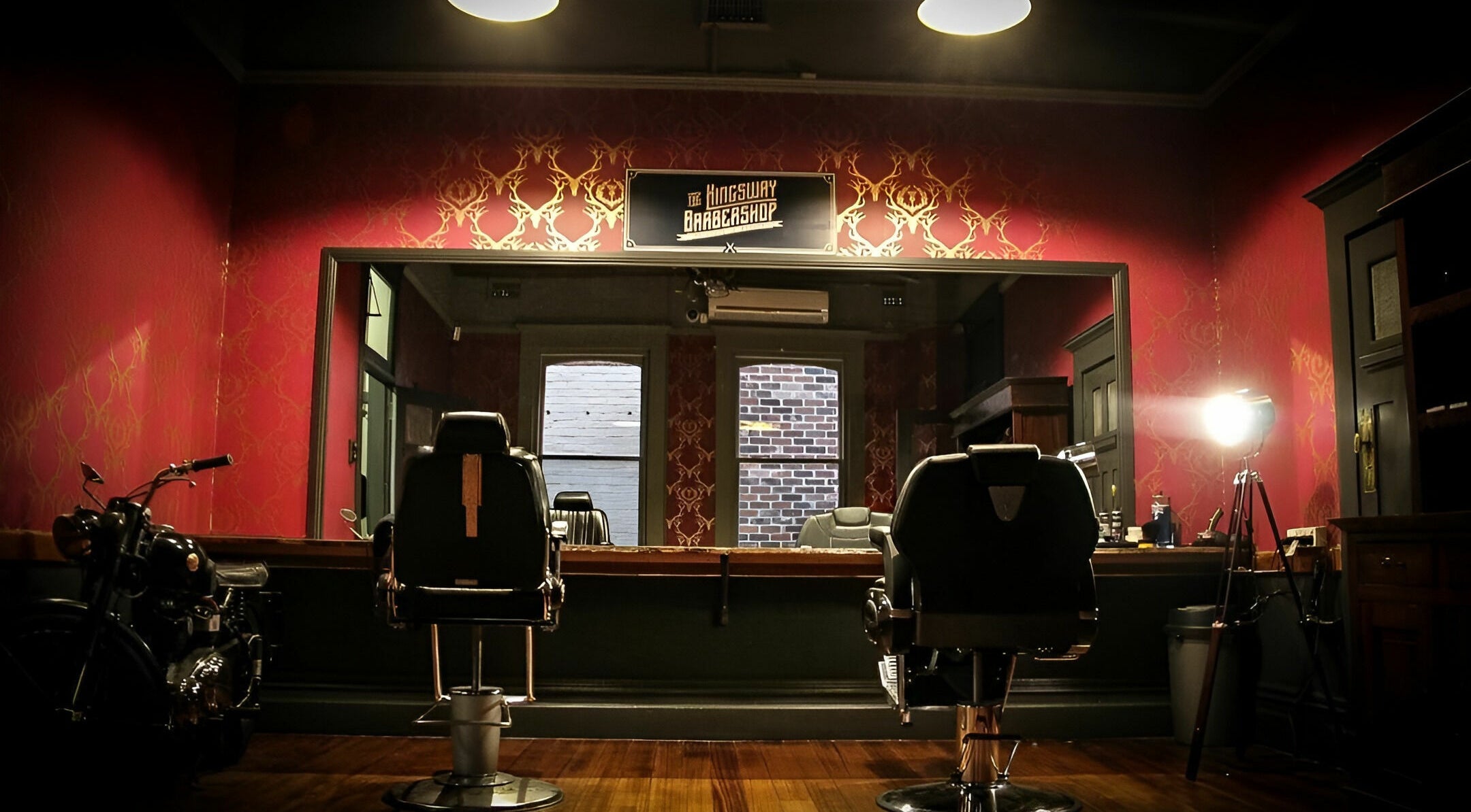Interior of The Kingsway Barbershop in Launceston, Tasmania, AU features vintage decor and barber chairs.