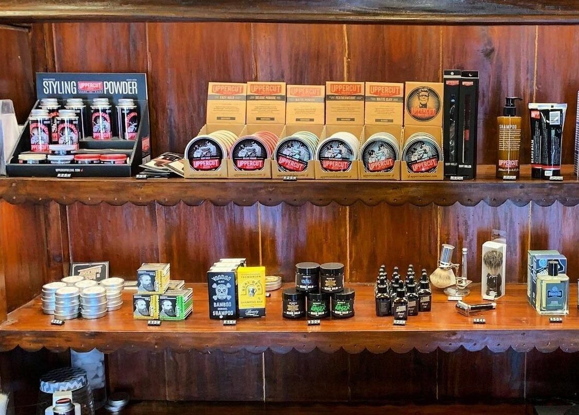 Grooming products on shelves at The Kingsway Barbershop in Launceston, Tasmania, AU, showcasing premium hair care.