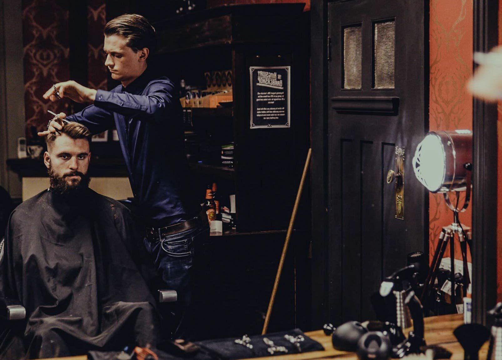 Stylist trims a client's hair at The Kingsway Barbershop in Launceston, Tasmania, AU showcasing expert grooming.