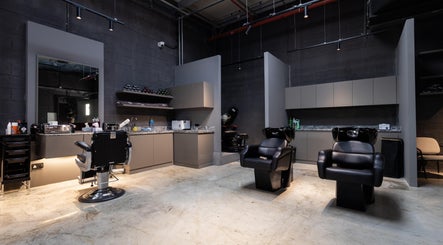 Modern interior of Lvls Barbershop in Dubai, Dubai, AE, featuring sleek barber chairs and stylish decor.