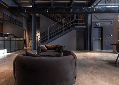 Sleek interior of Lvls Barbershop in Dubai, Dubai, AE, featuring modern lounge with stylish seating and industrial design.