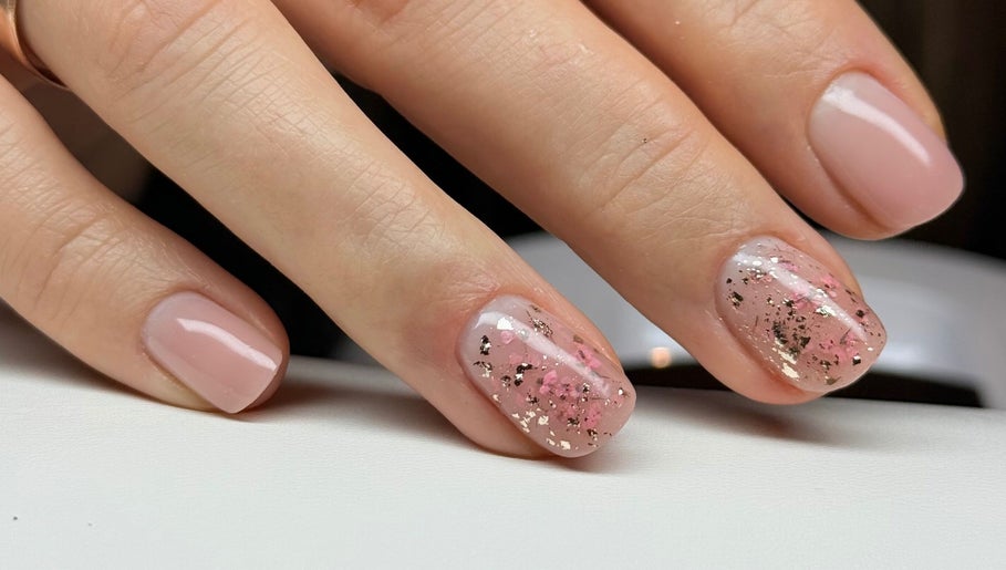 Stylish pink and gold glitter manicure at NatTal Beauty, Worcester, England, GB.