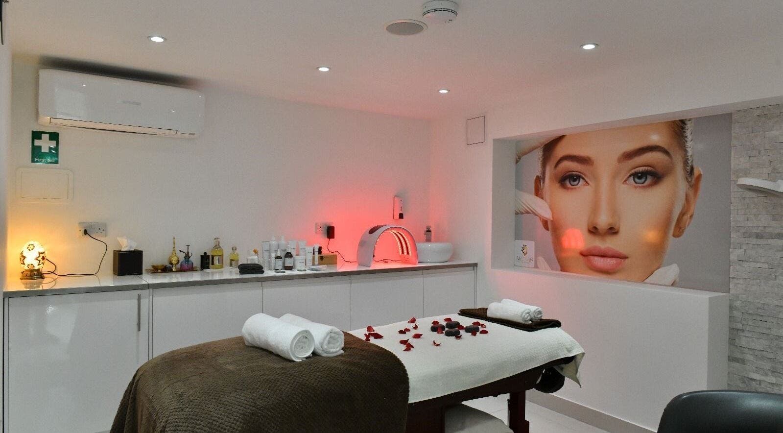 Relaxing treatment room at Arenas Spa & Beauty in London, England, GB, with massage table and ambient lighting.