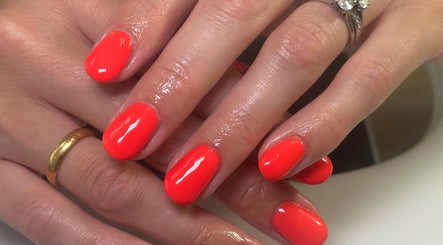 Glossy red manicure at Mani by Cody Thompson, Solihull, England, GB showcasing elegant style.