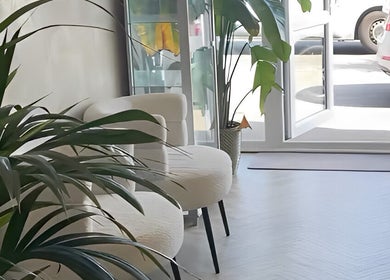 Bright, welcoming entrance at Mani by Cody Thompson, Solihull, England, GB with lush plants and seating.