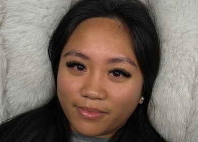 Woman showcasing elegant lashes by AC Lashes in Chandler's Ford, England, GB.