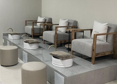 Modern pedicure chairs at D'ntle Beauty Randburg, Randburg, Gauteng, ZA, offering a serene wellness experience.