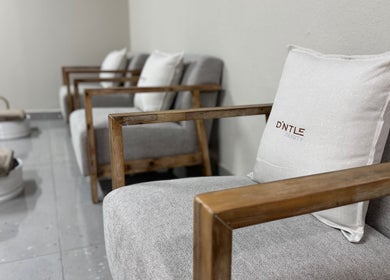 Elegant waiting area at D'ntle Beauty Randburg with plush chairs and cushions in Randburg, Gauteng, ZA.