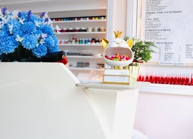 Reception area at Quinn Nails and Beauty Richmond, showcasing vibrant decor and colorful accents. Richmond, England, GB.