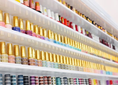 Colorful nail polish selection at Quinn Nails and Beauty Richmond, Richmond, England, GB on display shelves.