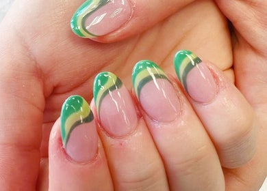 Green and yellow nail art on manicured hands at Quinn Nails and Beauty Richmond, Richmond, England, GB.