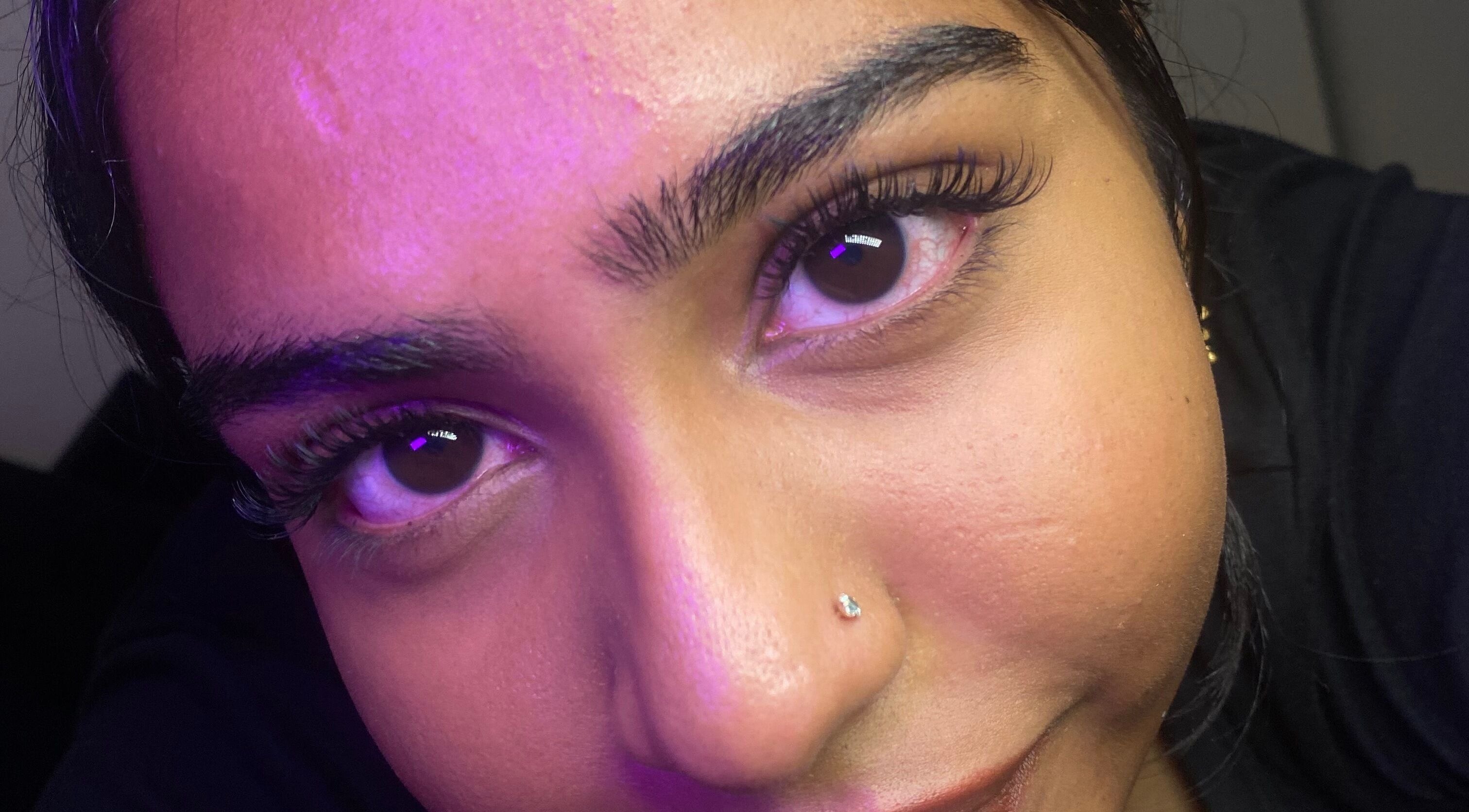 Close-up of a woman's face highlighting her eyes at Blinked Boutique, London, England, GB.