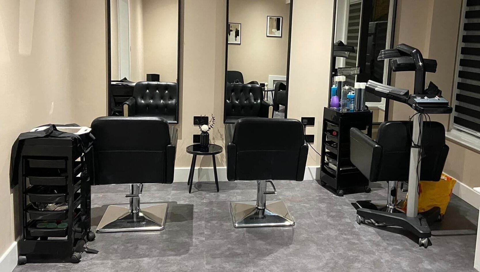 Modern salon chairs and mirrors at Beyond Beauty by louise, Ayr, Scotland, GB, exuding elegance and style.