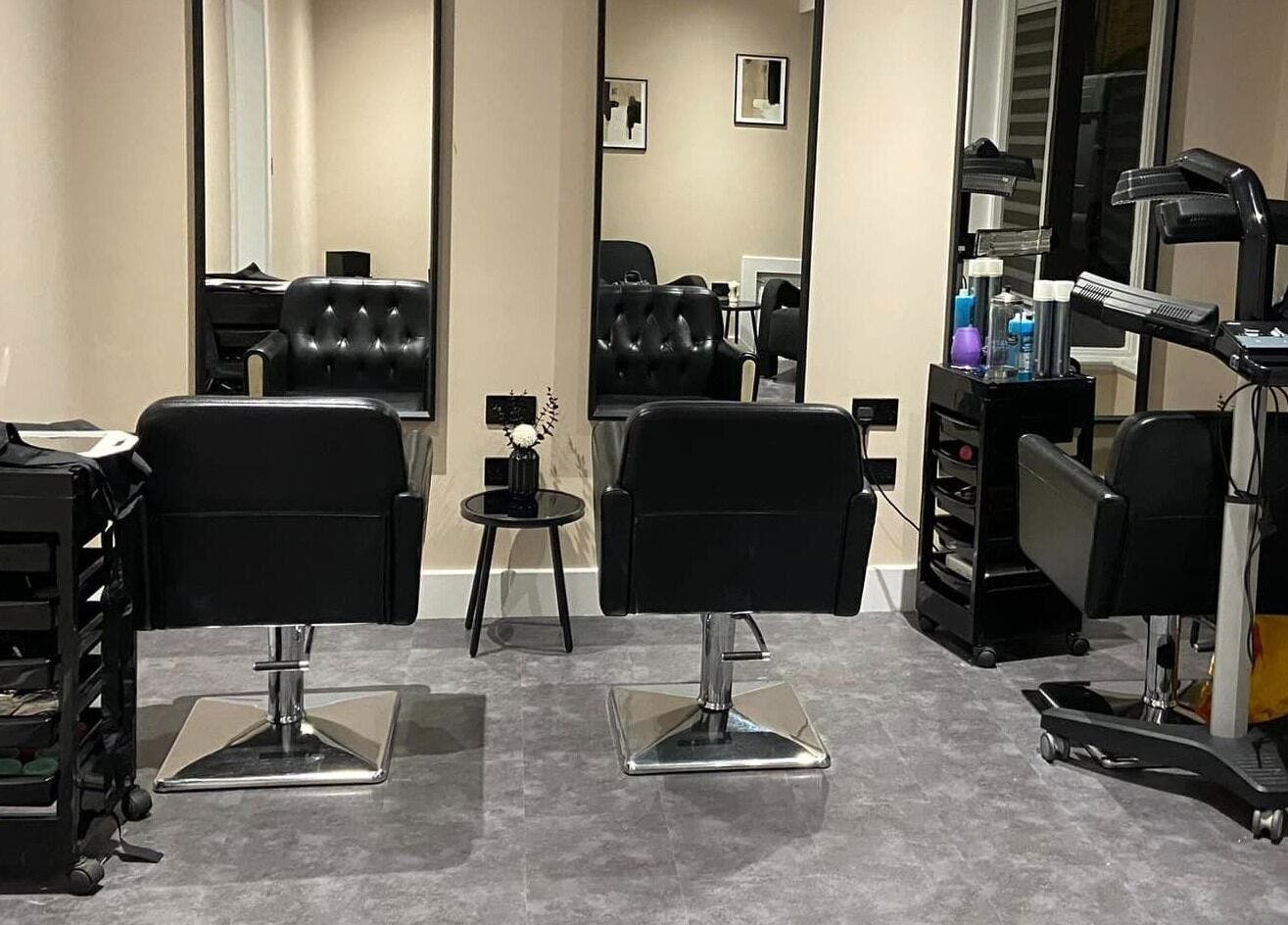 Modern salon chairs and mirrors at Beyond Beauty by louise, Ayr, Scotland, GB, exuding elegance and style.