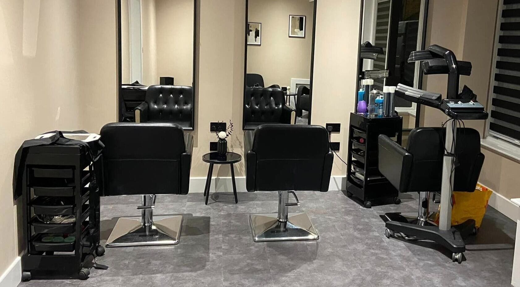 Modern salon chairs and mirrors at Beyond Beauty by louise, Ayr, Scotland, GB, exuding elegance and style.
