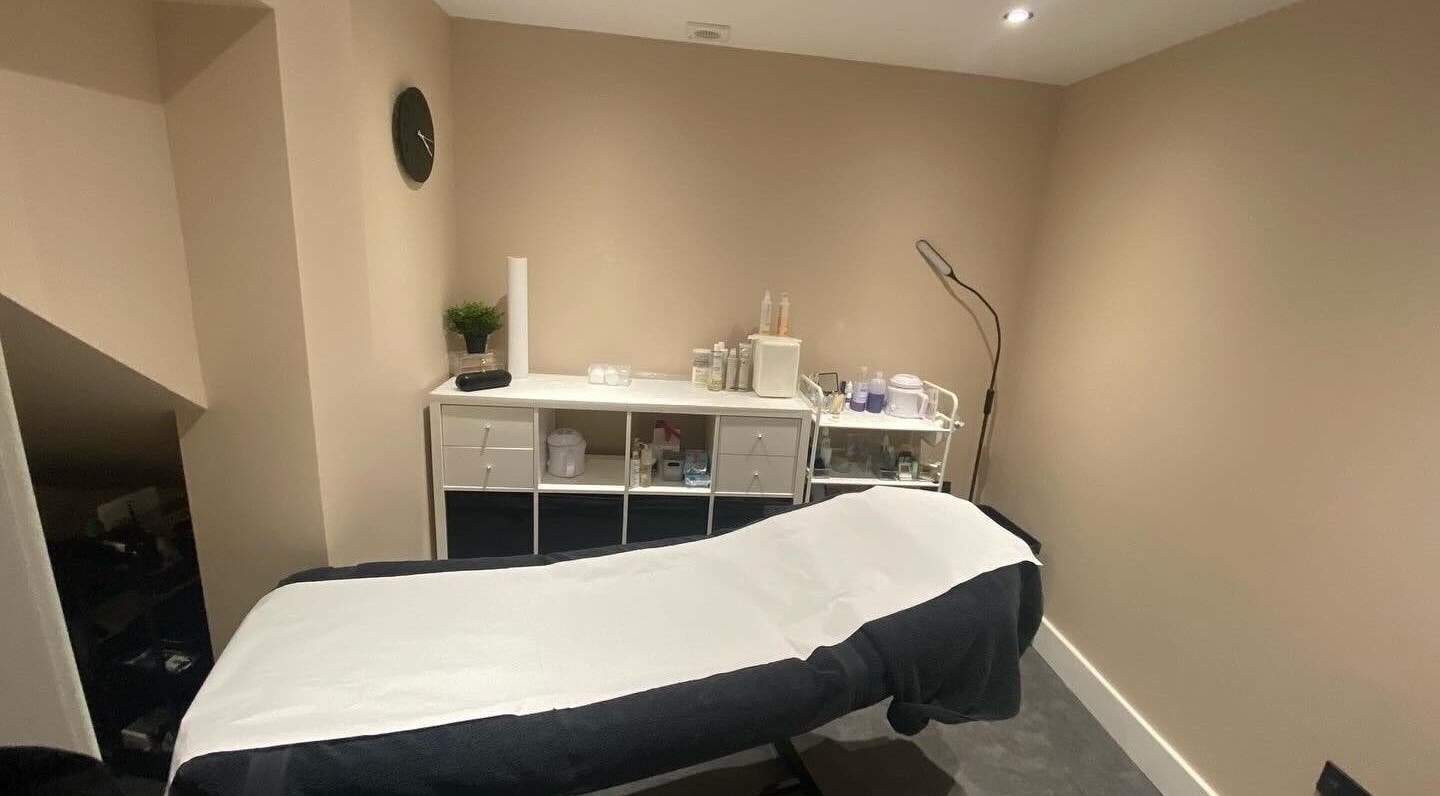 Tranquil treatment room at Beyond Beauty by Louise in Ayr, Scotland, GB, featuring a therapy bed and modern decor.