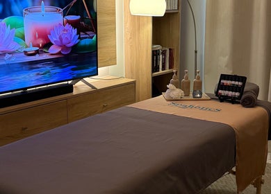 Relaxing spa room at Spaholics Home Wellness in Dubai, Dubai, AE with massage bed and calming decor.