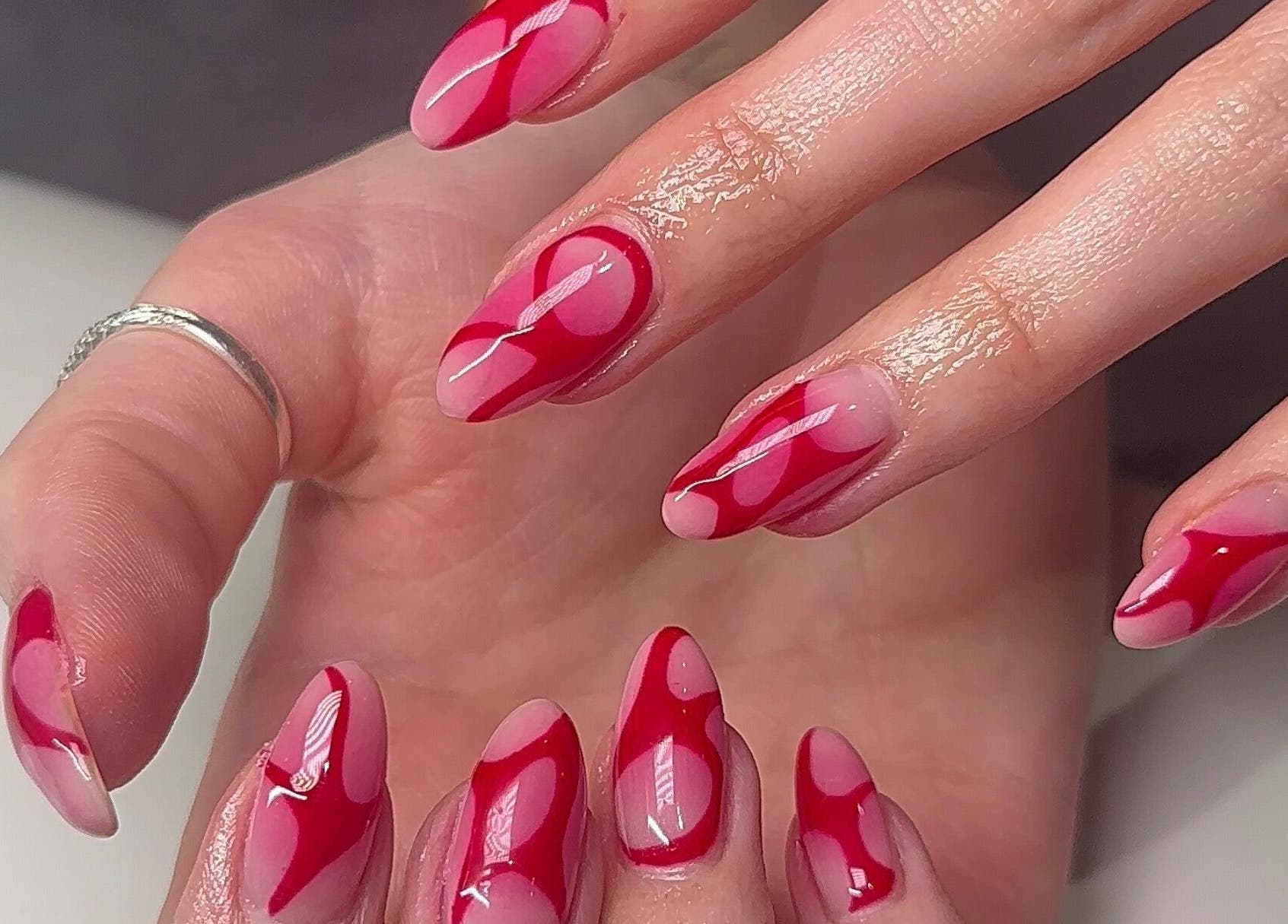 Red artistic nail design at Beauty by H.E.R, Moulton, England, GB.